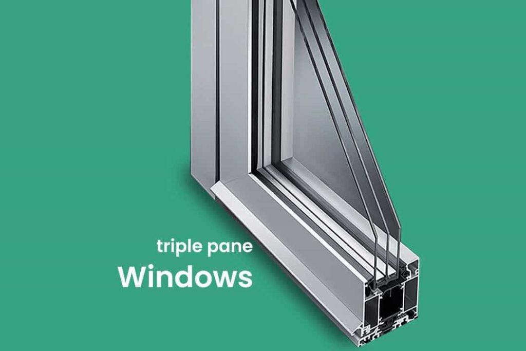 Detailed cross-section view of a high-performance aluminium window. It shows the triple-pane glass unit separated by two gas-filled spacers, housed within a thermally broken aluminium frame (highlighting the polyamide strip).