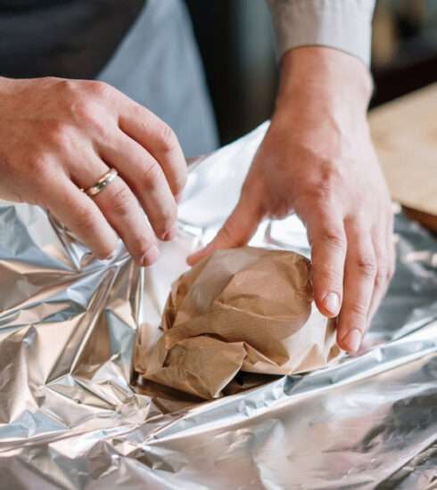 Why is aluminium foil used to wrap food items?
