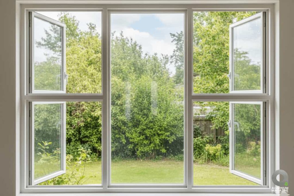 White aluminium four-panel casement window with two fixed central glasses and side-opening panels.