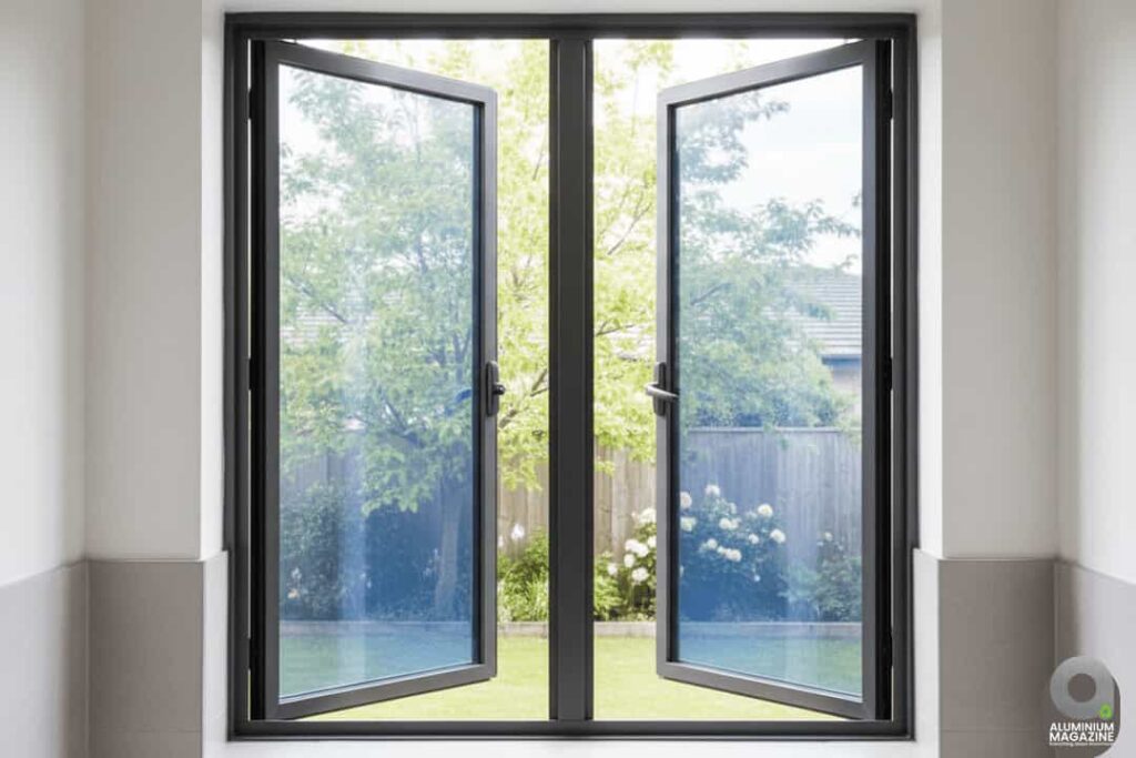 Wide casement window with two large outward-opening sashes, black aluminium frame.