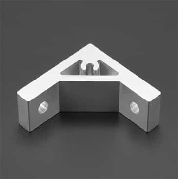 An extruded aluminium corner bracket with a gusseted internal design, commonly used to join two T-slot aluminum extrusions at a 90-degree angle with high torsional stability.