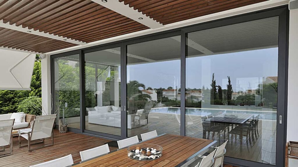Aluminium 6063 sliding glass door in modern home patio with large glazed panels and sleek frame