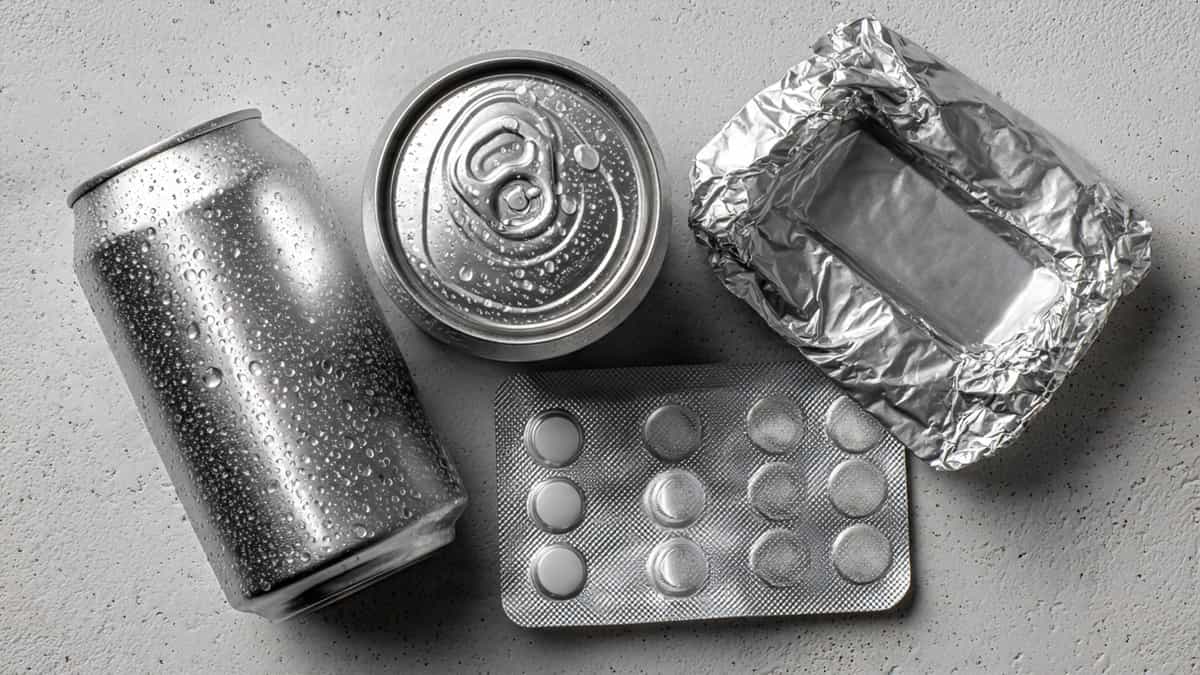 Collage of aluminium packaging including soda can, foil roll, blister pack, and takeout container.